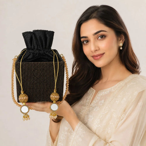 black rihnestone ptel clutch with pearl handle and gold tussle